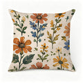 Decorative throw pillow with vintage orange and blue floral botanical patterns.