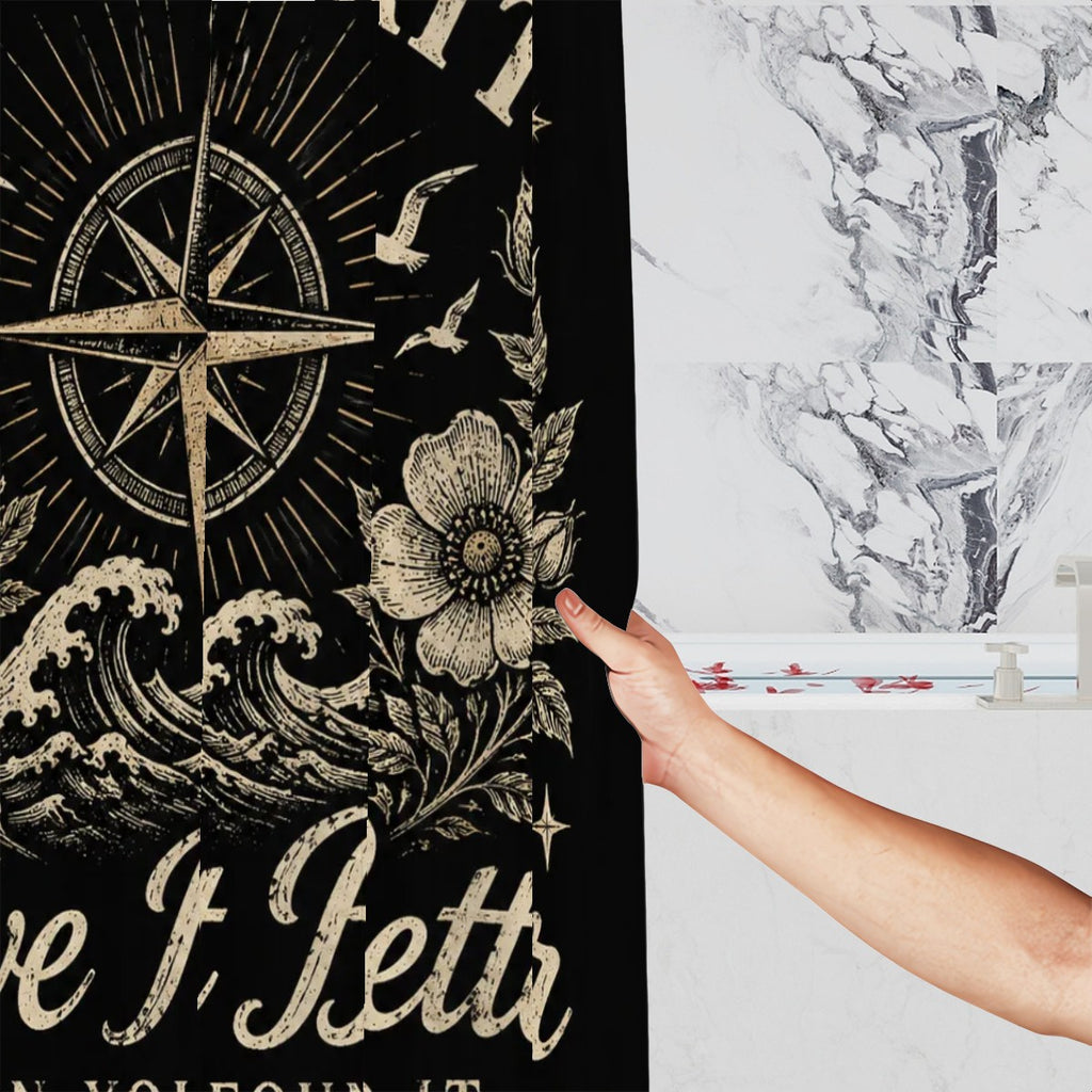 Black nautical shower curtain featuring a compass rose, ocean waves, and floral illustrations.